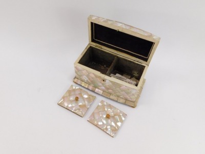 A 19thC mother of pearl inlaid tea caddy, the top with canted corners and a plated shield escuteon, on bun feet, opening to reveal a purple velvet lined interior, 14cm high, 24cm wide, 13cm deep. (AF) - 3