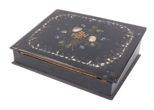 A Victorian ebonised and mother of pearl decorated papier mache desk top writing slope, the lid decorated with mother of pearl inlay and painted flower detailing, opening to reveal a crushed red velvet lined interior, pen slot and ink well, 9cm high, 32cm