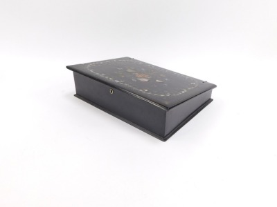 A Victorian ebonised and mother of pearl decorated papier mache desk top writing slope, the lid decorated with mother of pearl inlay and painted flower detailing, opening to reveal a crushed red velvet lined interior, pen slot and ink well, 9cm high, 32cm - 3