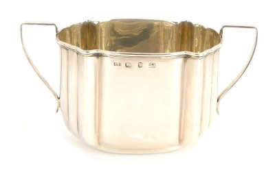 Vendor will collect 17.05/22 - A Victorian silver sugar bowl, with two handles and fluted body, Birmingham 1897, 4oz.