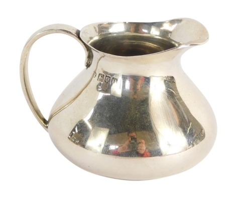 A George V miniature cream jug, of plain design, Charles Edwards London 1915, 1½oz.