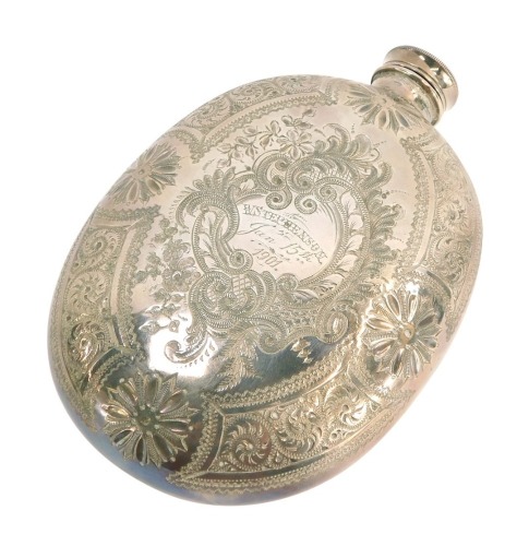 A 20thC silver plated hip flask, with foliate scroll decoration and central shield inscribe W Stephenson January 15th 1901, white metal unmarked, with screw in top, 14cm high.