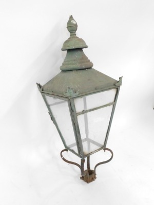 A late 19thC wrought iron street lamp top, the bulbous finial top on four panelled supports with scroll cast details, 98cm high. (AF) - 2