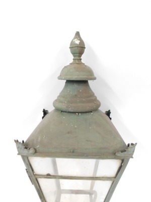 A late 19thC wrought iron street lamp top, the bulbous finial top on four panelled supports with scroll cast details, 98cm high. (AF) - 3