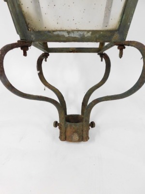 A late 19thC wrought iron street lamp top, the bulbous finial top on four panelled supports with scroll cast details, 98cm high. (AF) - 4