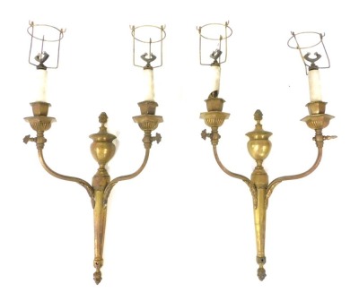 A pair of early 20thC gilt brass wall lights, each in French style, 56cm high.