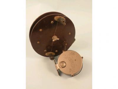 A metal fishing reel 'The Gemina" and a Scarborough type base
