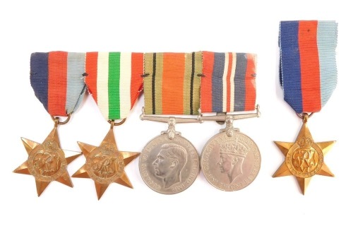 A group of WWII medals, comprising a 1939-45 Star, Italy Star, Defence Medal, and 1939-45 War Medal, together with a further 1939-45 Star. (5)