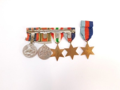 A group of WWII medals, comprising a 1939-45 Star, Italy Star, Defence Medal, and 1939-45 War Medal, together with a further 1939-45 Star. (5) - 2