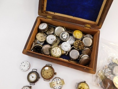 Early 20thC wristwatches, some silver cased, together with movements, winders, dials, etc, in an Indian carved hardwood box. (a quantity) - 2