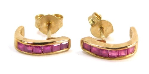 A pair of 9ct gold ruby hoop earrings, each with square cut rubies in torc design with single pin back with butterfly back, 1cm high, 1.6g all in, boxed.