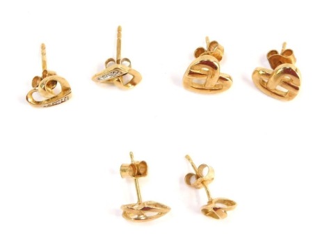 Three pairs of 9ct gold earrings, comprising two heart studs and a pair of basket weave studs, 3.4g all in.