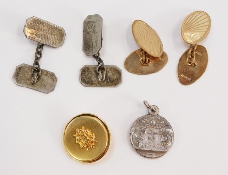 Two sets of cuff links and accessories, comprising a pair of 9ct gold oval sunburst cuff links, 5.2g, a pair of silver engine turned decorated octagonal cuff links, 6.7g, and a plated button and pendant. (a quantity)