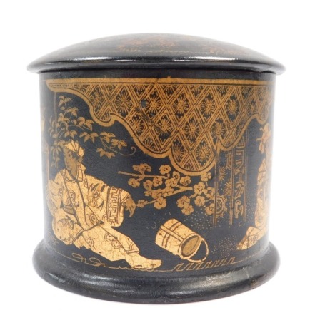 A Victorian papier mache box, in Oriental style painted gold figures and flowers, with a domed top, 7cm high, 8.5cm diameter.