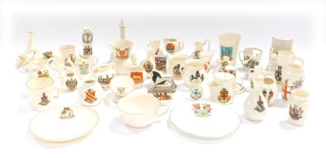 A group of crested china, comprising Knaresborough Goss beaker, Blackpool Tower, Tuxford longcase clock and others. (a quantity)