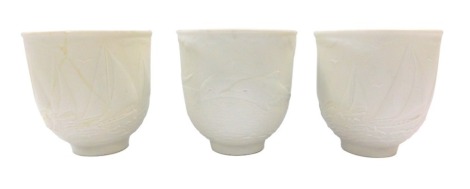 Three Lladro Collector's Society bowls, two dated 1997, with ship decoration, 9cm high, and a 1998 dolphin decorated vase. (AF)