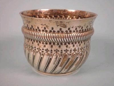 An Edwardian part fluted silver sugar bowl with hammered decoration of arrows