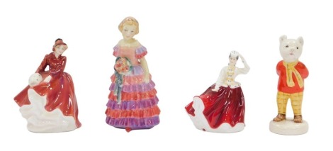 Three Royal Doulton figures, comprising miniature Gayle HN3321, miniature Emma HN3208, small The Little Bridesmaid, and a small Beswick Rupert and The Bear figure. (4)