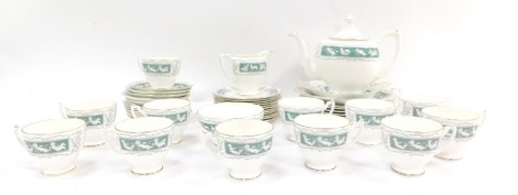 A Coalport Revelry-Adam Green pattern part tea service, comprising teapot, milk jug, sugar bowl, twelve cups and saucers, twelve side plates, two cake plates and six dinner plates.