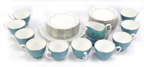 A Royal Adderley china part tea service, on a turquoise ground with silvered border, fern spray, milk jug, sugar bowl, ten cups, twelve saucers, twelve side plates and a cake plate.