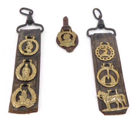 A group of early 20thC horse brasses, comprising King George and Queen Mary commemorative horse brass, two leather bridles with three horse brasses from similar datings. (a quantity)