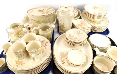 An extensive Wedgwood part dinner and coffee service in the Peach pattern, comprising three salt and pepper pots, three egg cups, milk jug, sugar bowl, two small coffee cans, three large coffee cans, gravy boat, eight side plates, eight dinner plates, fiv