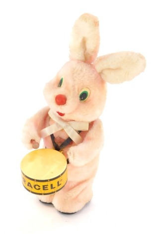 A Duracell Bunny advertising, formed as a pink rabbit playing Duracell drum, 35cm high.