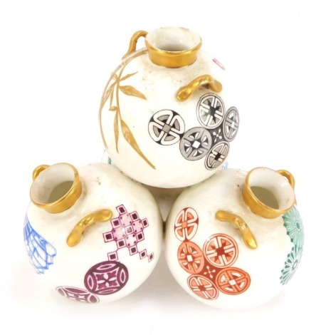 A Royal Worcester aesthetic ceramic pot pourri vase, form as four orbs, each with painted decoration and gilt borders with bamboo effect handles, with green Worcester stamp to underside, 14cm high.