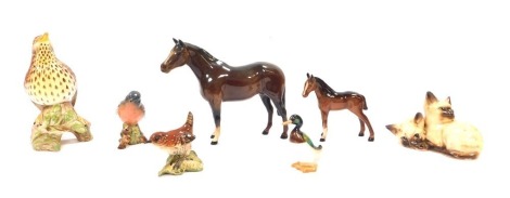 A group of Beswick animal ornaments, comprising Siamese cat group, duck, two horses, wren, chaffinch, and a further bird on perch branch. (7)