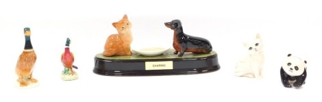 A group of Beswick ornaments, comprising Sharing, on plinth with cat and dog figure feeding from a bowl, 22cm wide, Beswick panda, cat, duck and pheasant. (5)