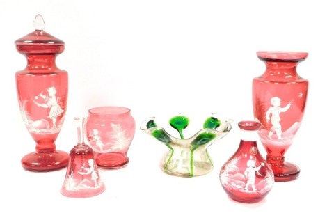 A group of Mary Gregory style glass, comprising vase and cover, 32cm high, matching vase, lacking cover, a bell, 14cm high, small vase, 10cm high, decanter, lacking stopper, 14cm high, and a flared Art Nouveau style art glass bowl. (6)