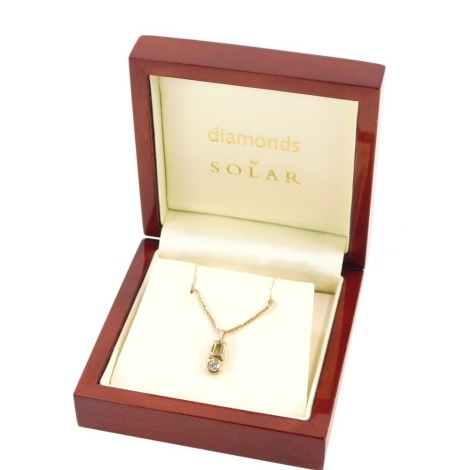 A 9ct gold Diamond by Solar pendant and chain, the diamond set pendant in rub over setting, measuring approx 0.20cts, on a fine link chain, the pendant 1cm high, the chain 40cm long, 3g all in, boxed.