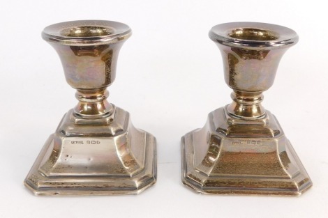 A pair of George V silver dwarf candlesticks, Birmingham 1932, with weighted bases, 8oz gross.