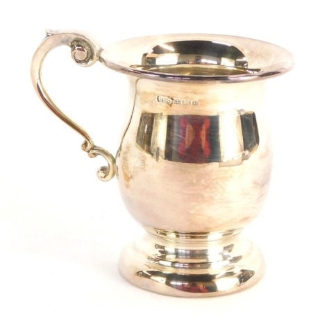 An Elizabeth II silver Christening mug, with scroll handle, Birmingham 1960, 3½oz.