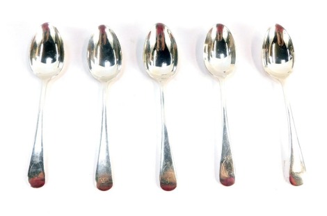 Five silver teaspoons, each with Fiddle pattern top and crest stamped BC, four for Sheffield 1930 and 1932 and a later edition London 1914, 2¾oz.