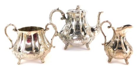 A Victorian three piece silver plated tea service, with fluted and floral embossed design to body.