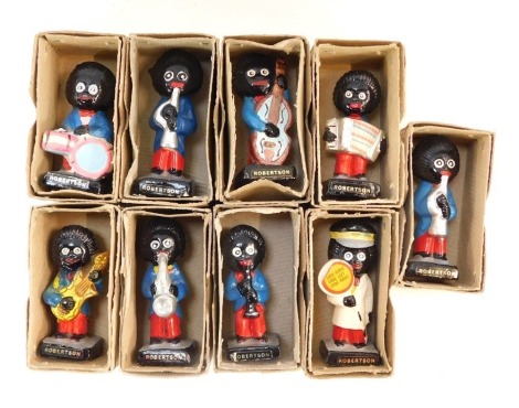 Nine Robertsons advertising figures, to include clarinet player, bongos, accordion, trumpet, clarinet, lollipop man, violin, guitar, etc, each in individual cardboard box.