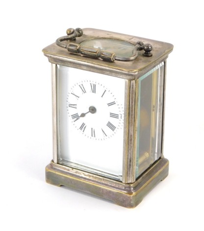 A silver plated carriage clock, the white enamel dial with Roman numeric chapter ring, with one hand, with thirty hour movement and swing handle, unmarked, 12cm high, 8cm wide, 6cm deep. (AF)