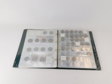 George V and later pre decimal coinage, one farthing through to a crown, together with banknotes, including Forde and Beale ten shillings, one and five pounds, in one album.