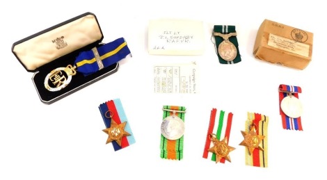 Medals and cap badges, comprising Army Emergency Reserve Medal and ribbon, cap badges, Flight Lt J L Suddaby Air Efficiency Award Medal, 1939-45 Defence Medal, 1939-45 Star, The Italy Star, and The Africa Star, each with ribbons, unassigned.