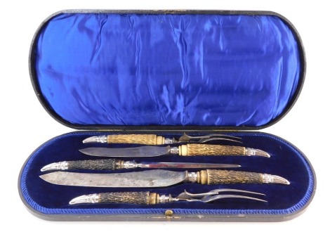 A James Deakin & Sons of Sheffield antler handled and stainless steel carving set, in a black fitted case with blue velvet cushion.