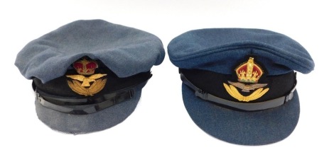 Two RAF officer's peaked caps, one bearing a label for Aekit, Cambridge Circus (2).