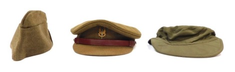 Three military caps, comprising a British Army peaked cap, a field service cap and a Dutch Army cap. (3)