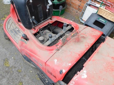 A Honda Hydrostatic control ride-on mower, model 2800SH, in red. - 3