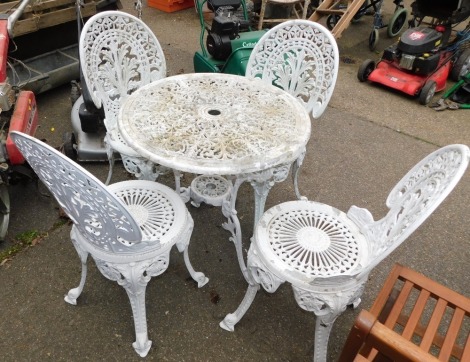 A Coalbrookdale style white painted metal garden table and chair set, with table and four chairs. (5)