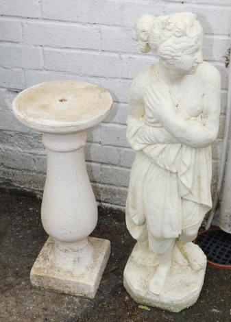 A figure of a semi clad lady, in reconstituted stone, over painted in cream, with a matched pedestal base, the figure 81cm high, the base 54cm high. (2)