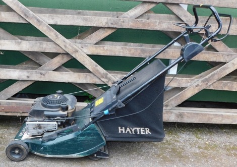 A Hayter Harrier 41 petrol lawnmower, with handbook.