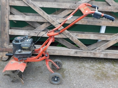 A Briggs & Stratton M1 Gardener petrol cultivator, 148cc, 3.5hp, in red.