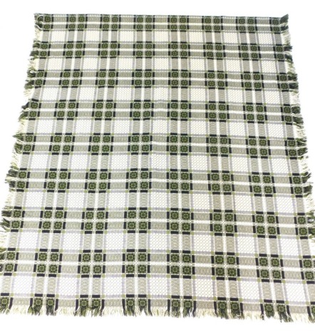 A Welsh blanket, in green, cream and black chequered design with tassel ends, 240cm x 200cm.