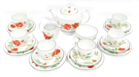 A Royal Worcester tea service in the Poppies pattern, comprising teapot, milk jug, sugar bowl, six cups and saucers, and six side plates.